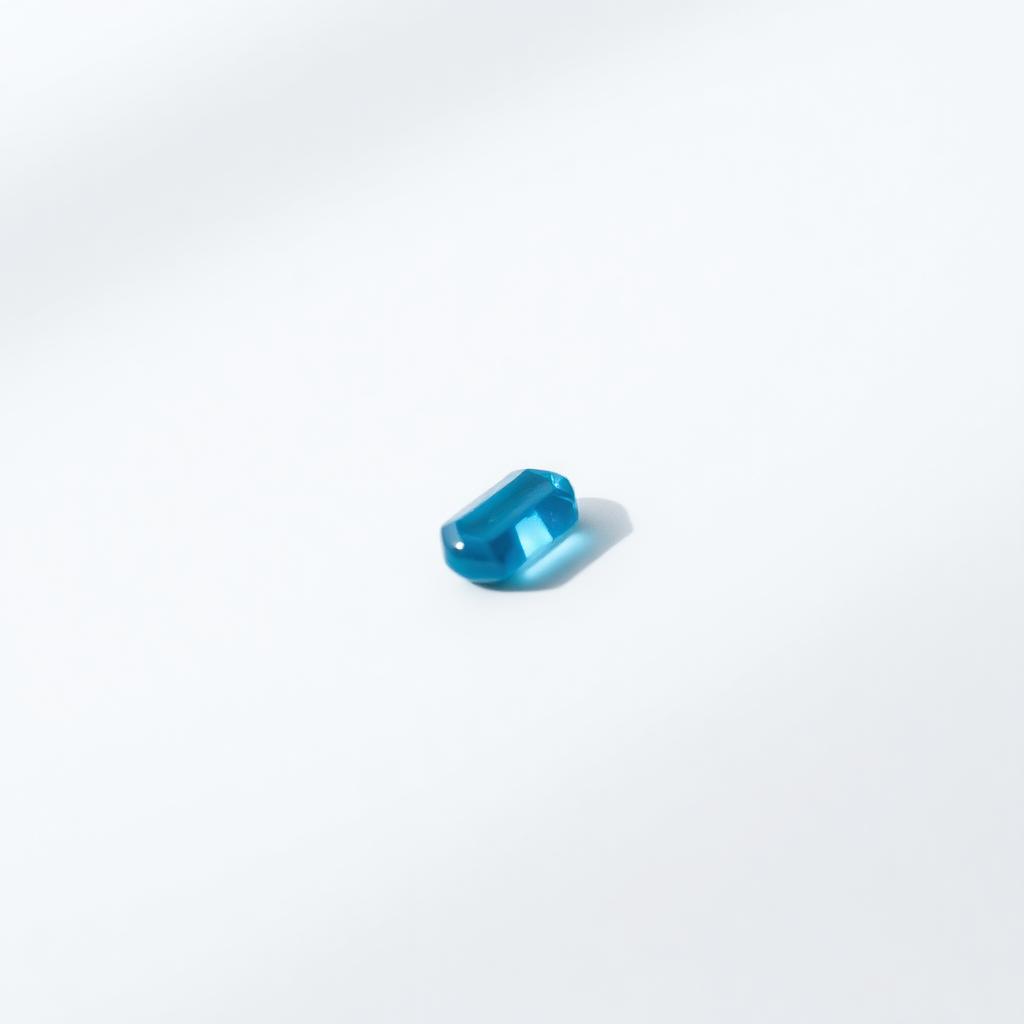 Small blue sildenafil tablet on a clean white background